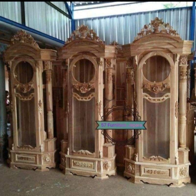 Lemari jam besar ukir motif bunga mawar jati mentahan jam hias masjid