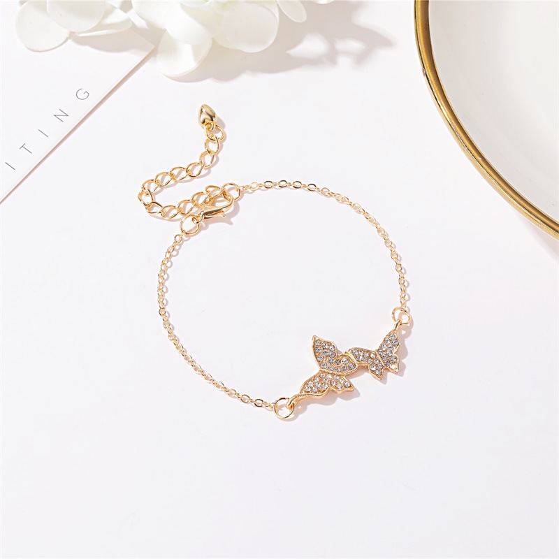 Gelang Rantai Desain Double Butterfly Bahan Cubic Zirconia Warna Emas Untuk Wanita