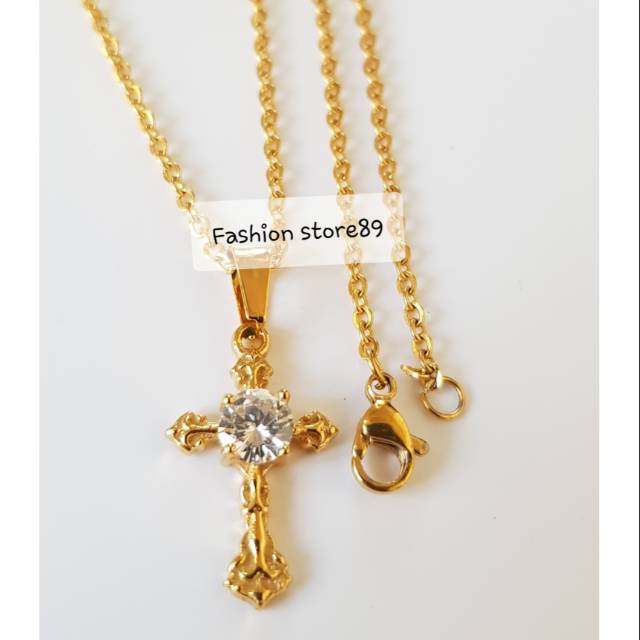 Kalung salib gold permata titanium import / kalung fashion rohani import titanium Antikarat KS011