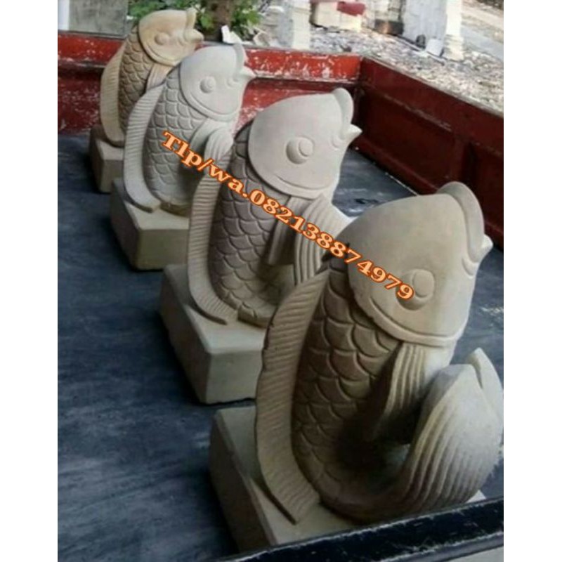 patung ikan batu alam