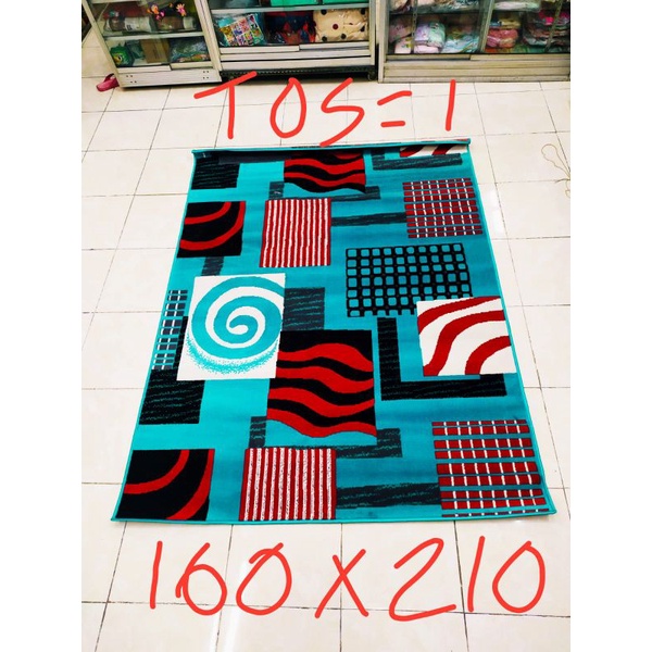 Karpet permadani motif abstrak