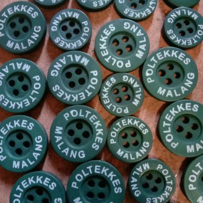 kancing jas almamater Poltekkes malang