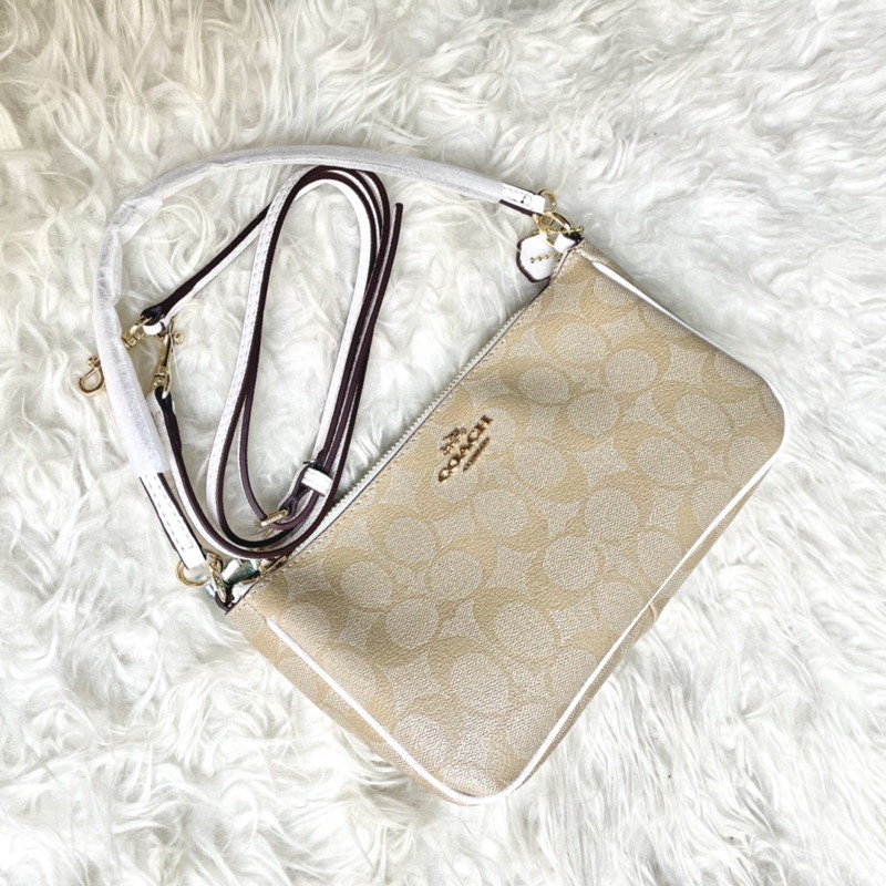 COACH TOP HANDLE POUCH IN SIGNATURE CANVAS - WHITE