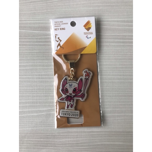 ORIGINALS TOKYO OLYMPIC PARALYMPIC MERCHANDISE - KEYCHAIN SOMEITY GOLD PINK