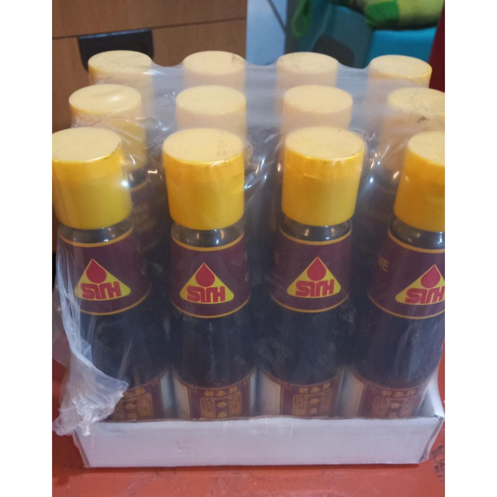 Sin Tai Hing STH sesame oil/ Minyak Wijen botol 210 ml