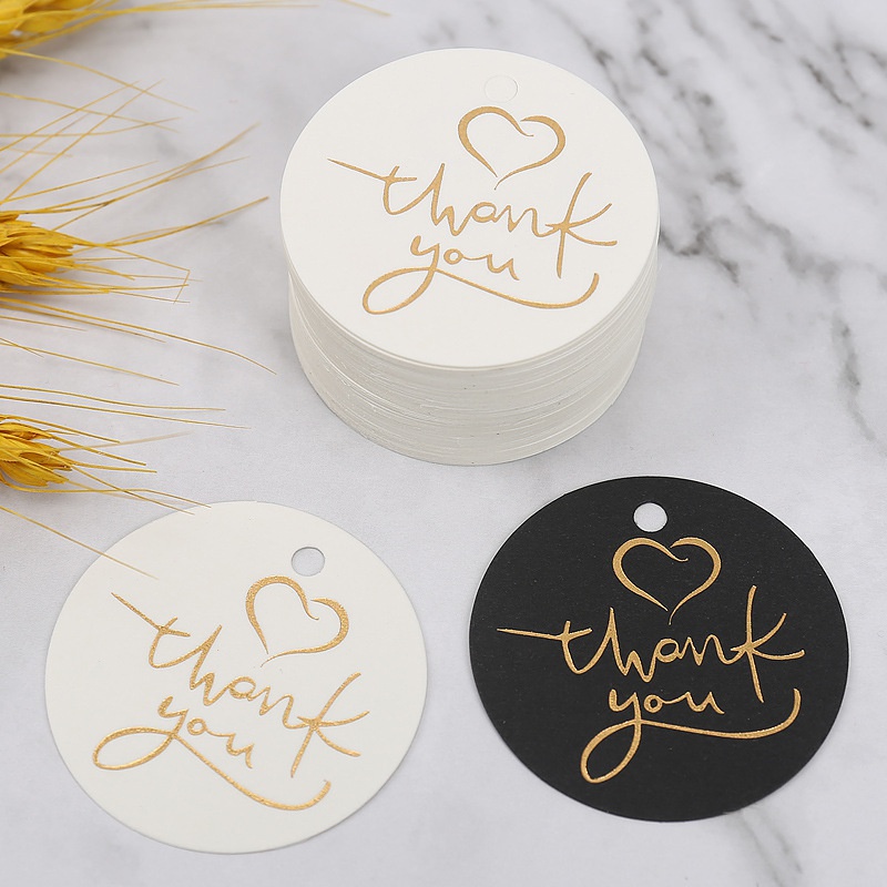100pcs / Set Kartu Tag Gantung Bentuk Bulat Tulisan Thank You Warna Hitam / Putih Untuk Dekorasi Kemasan Kue