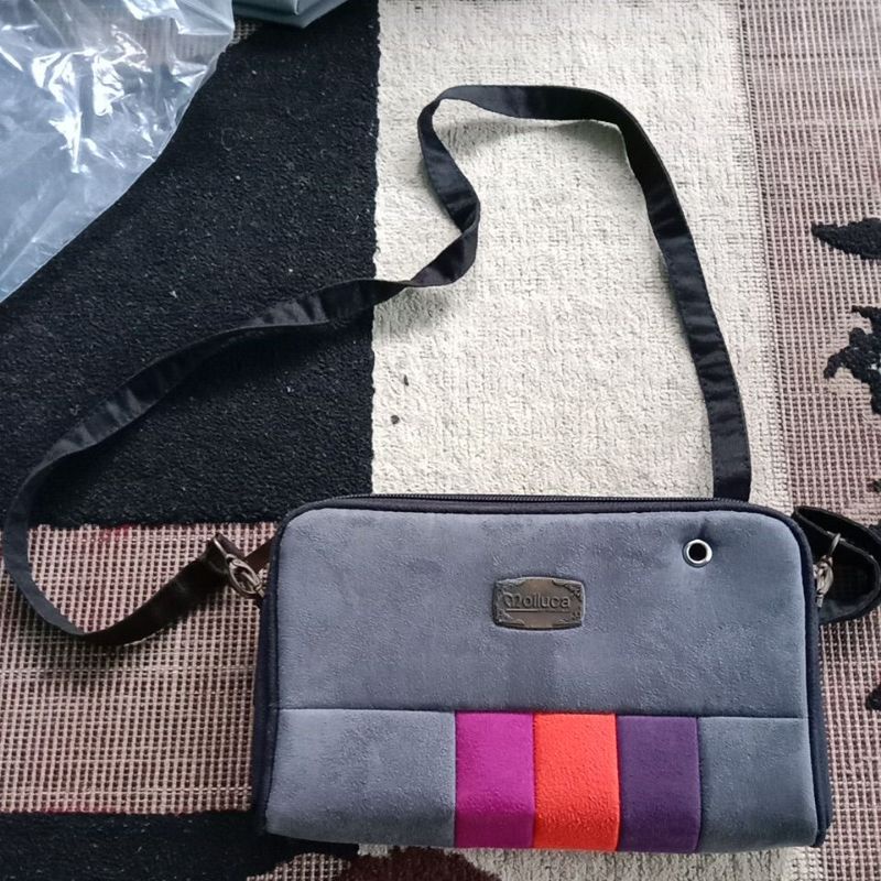 Tas dompet wanita molluca