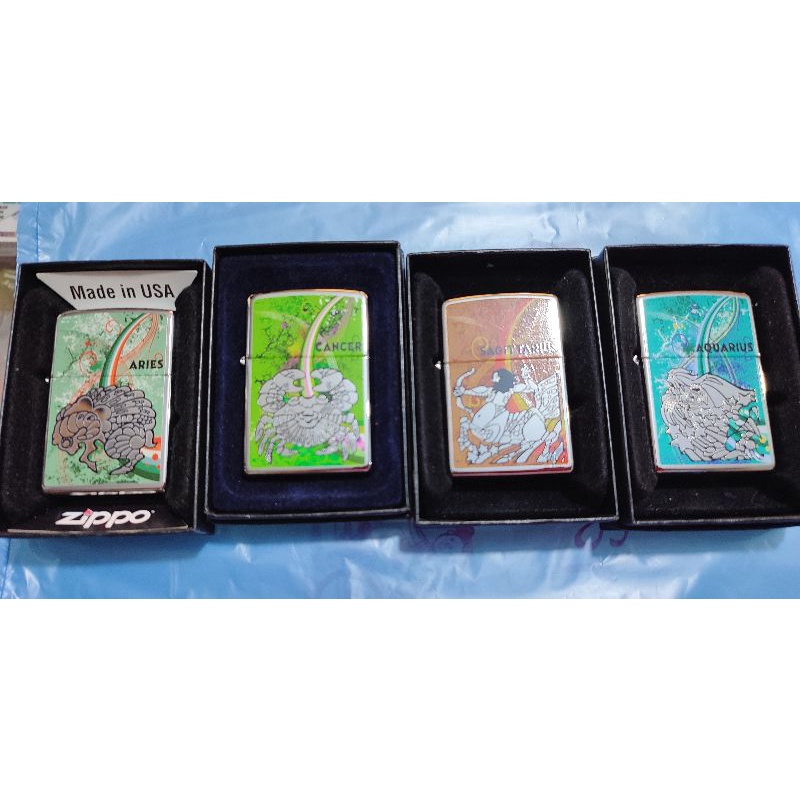 korek Zippo asli motif zodiak