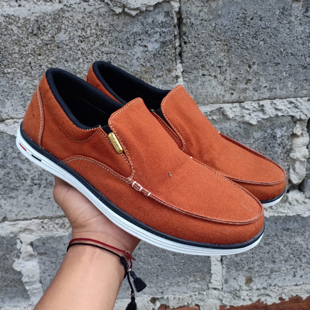 SEPATU HUSH PUPPIES SLIP ON CANVAS DENIM COKLAT IMPORT SEPATU PRIA KERJA KANTORAN KEREN SEPATU PANTO