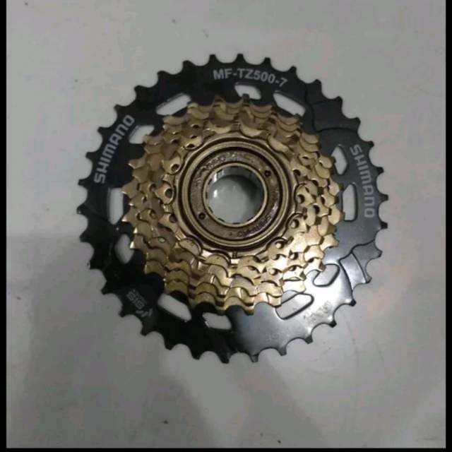 Freewheel sprocket megarange 7speed merk Shimano model drat ulir ukuran 14-34T