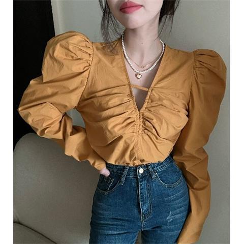 French retro v-neck longgar pendek lipit kemeja wanita musim semi dan musim gugur desain niche chic gelembung atasan lengan panjang