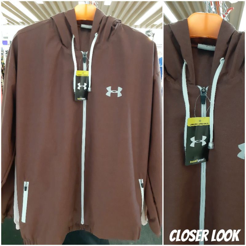 Jaket running UA waterproof coklat bata