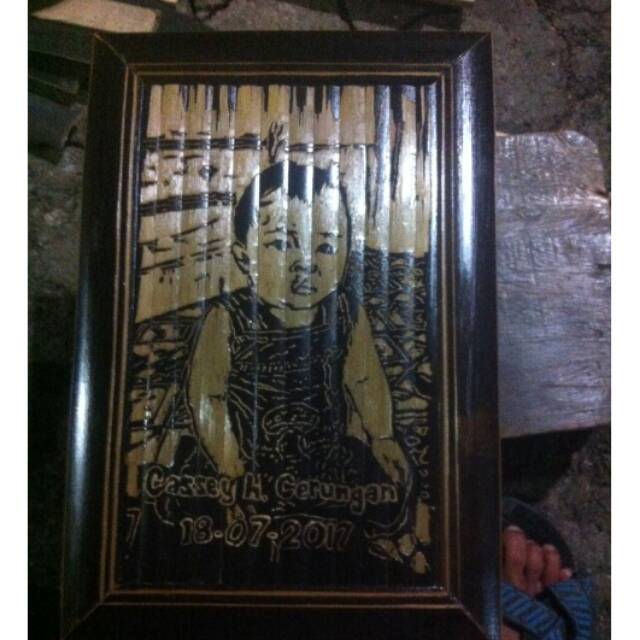Ukiran wajah dari bambu
