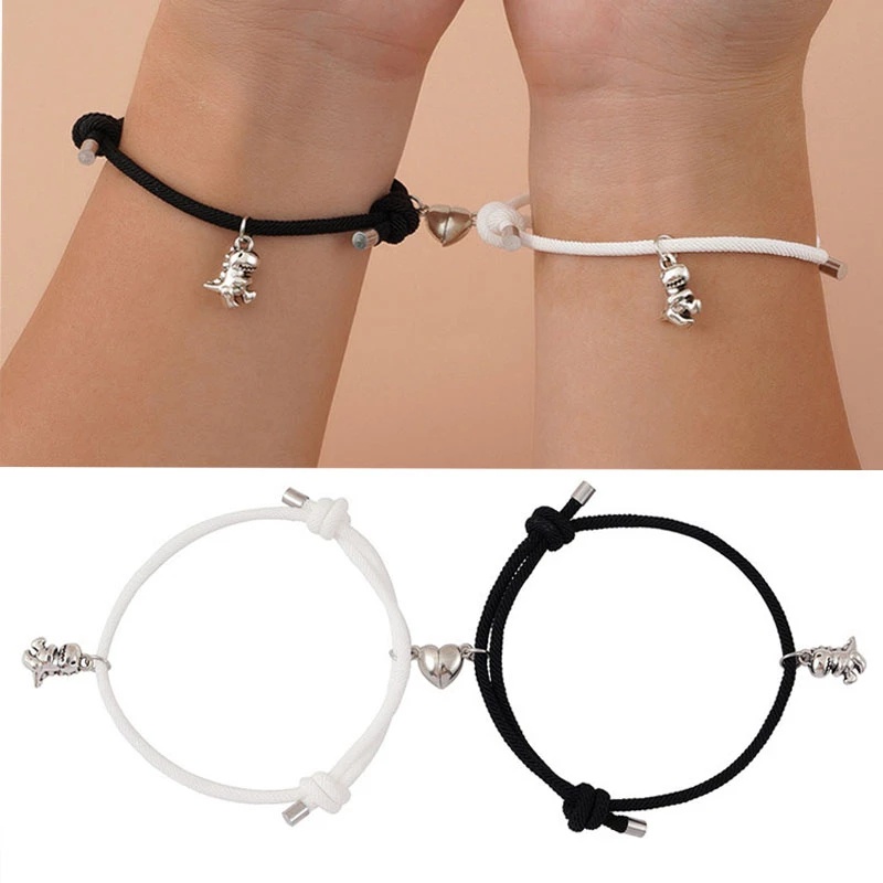 1 Pasang Gelang Magnet Liontin Dinosaurus Kecil Bahan Alloy Warna Hitam Putih Untuk Pasangan