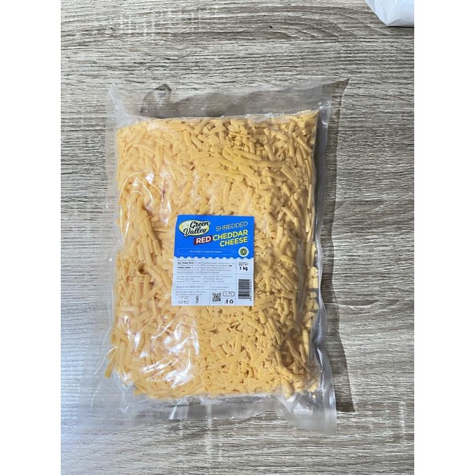 

BISA BAYAR DITEMPAT Keju Cheddar Merah Parut Green Valley 1kg / Shredded Red Cheddar