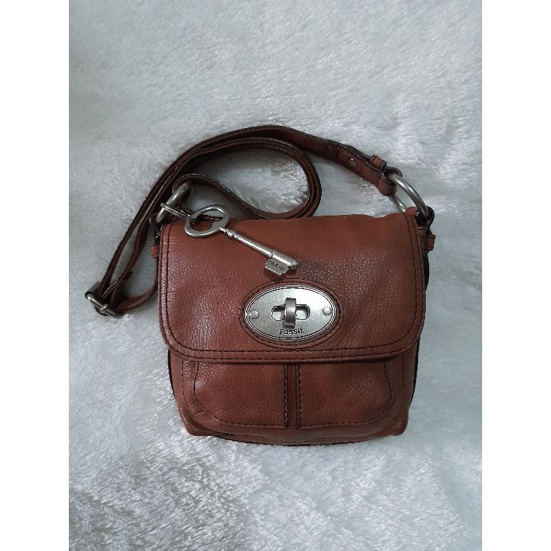 tas fossil maddox turnlock chesnut preloved