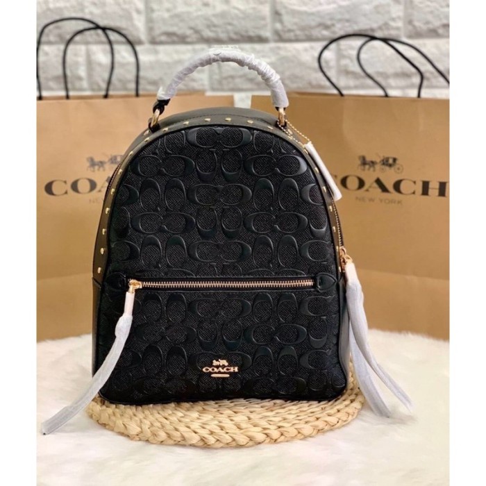 C0ACH JORDYN BACKPACK IN SIGNATURE LEATHER WITH RIVETS