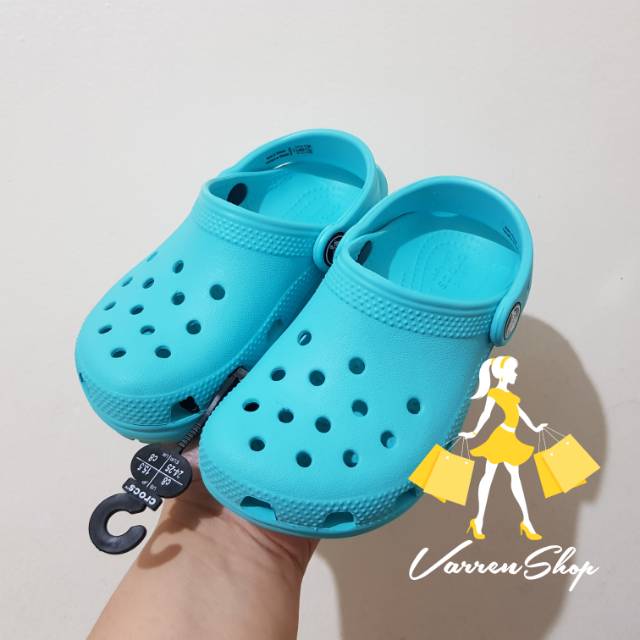 teal crocs kids