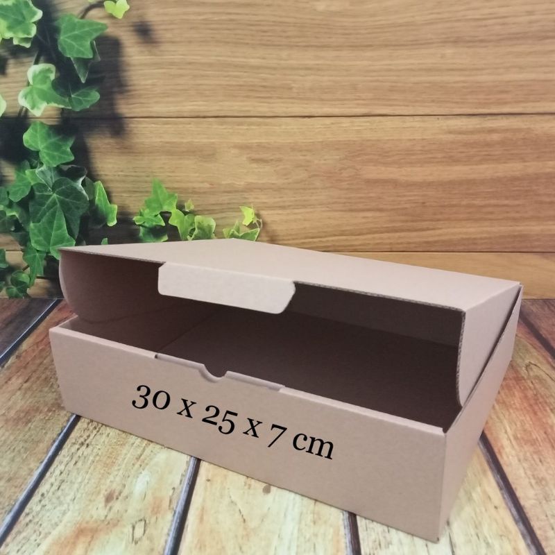 

kardus 30 x 25 x 7cm.. die cut