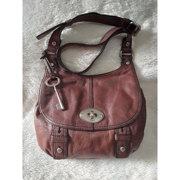 tas fossil maddox turnlock slingbag preloved
