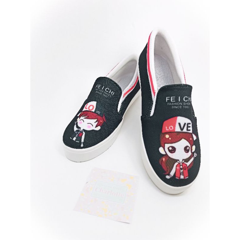 SEPATU WANITA SLIP ON KARAKTER LOVE BOY BEST SELLER MURAH WARNA HITAM DAN PUTIH UKURAN 36-40