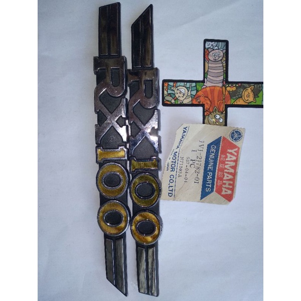 PART RX100/AKSESORIS MOTOR TUA RX100,EMBLEM SIDE COVER RX100 ORIGINAL LR