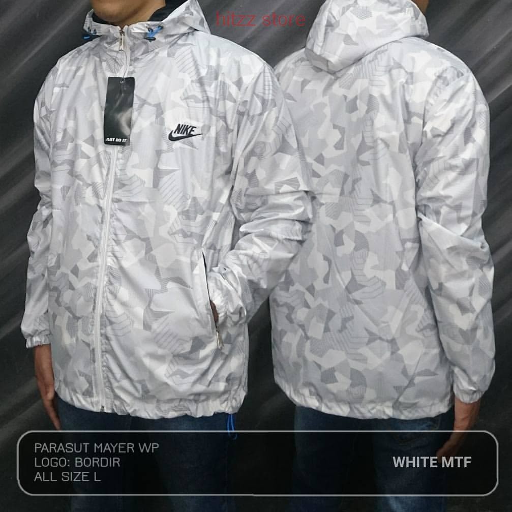 PREMIUM AH270 JAKET PARASUT RUNNING SPORT NIKE PUTIH MOTIF LOGO NIKE HITAM TERBARU