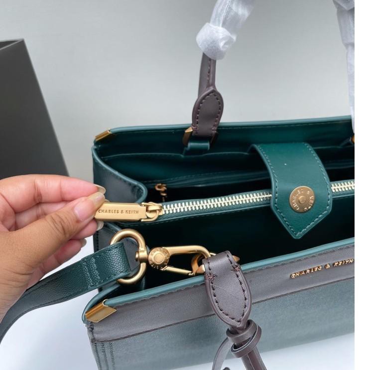 CK Metallic Edge Top Handle Bag .