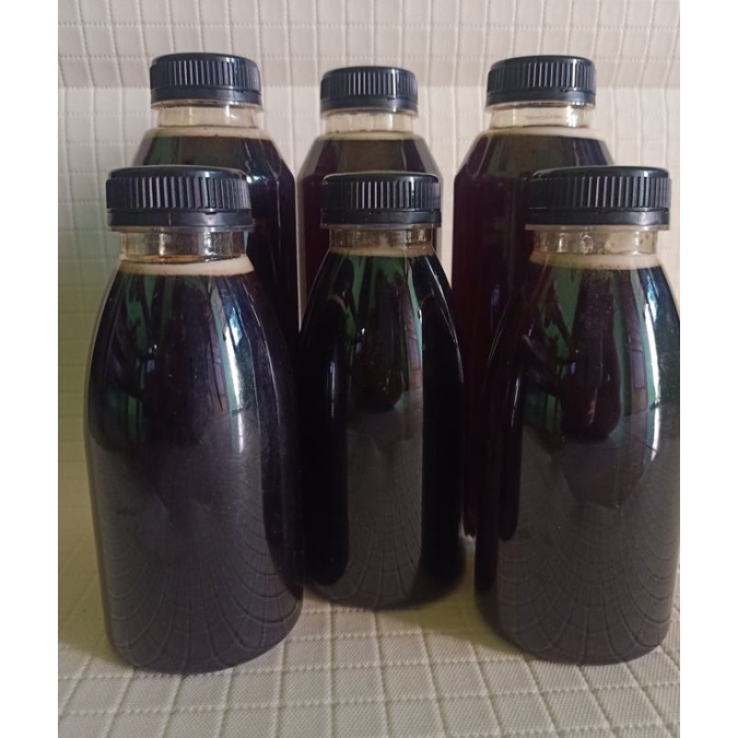 

madu hitam hutan akasia