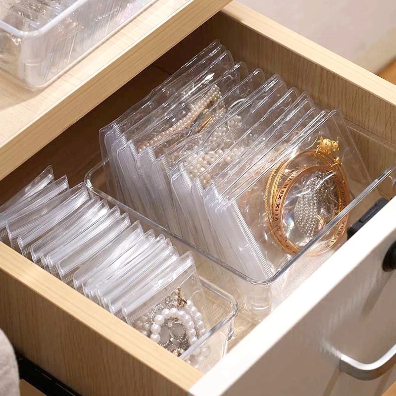 Tas Penyimpanan Perhiasan Cincin / Kalung / Gelang / Anting Portable Bahan PVC Transparan Anti Oksidan / Debu