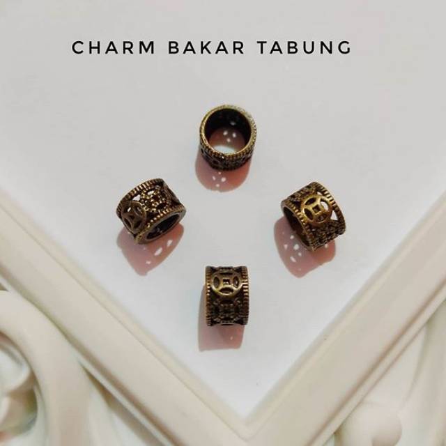 Charm bakar tabung