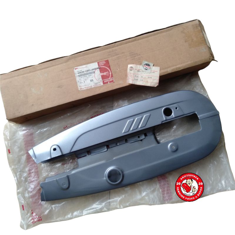 KETENGKAS TUTUP RANTAI ATAS BAWAH ABU ABU HONDA ASTREA GRAND BULUS ORI ASLI 40520-GN5-830ZA