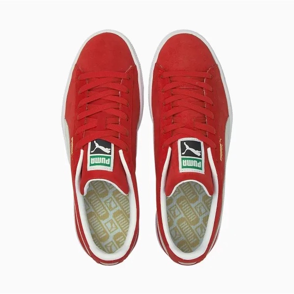 white and red puma trainers