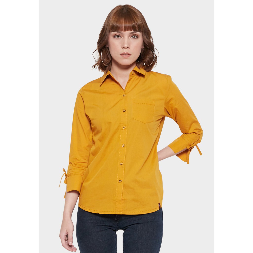 mustard shirt and jeans
