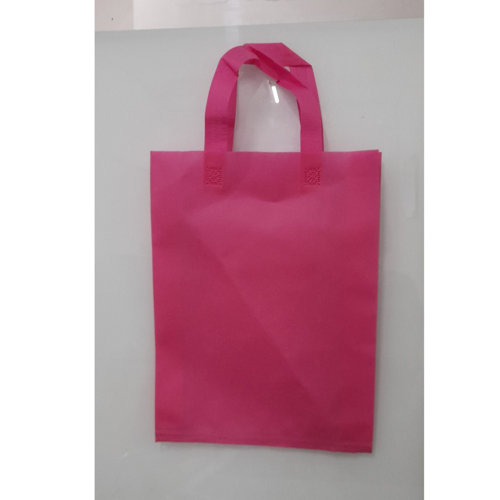 

(Lusin) Tas Press Spunbound Tali Goodie Bag Tas Belanja Warna Pink 25 cm x 35 cm