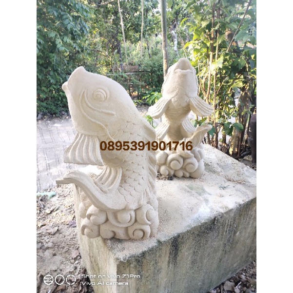 patung air mancur ikan