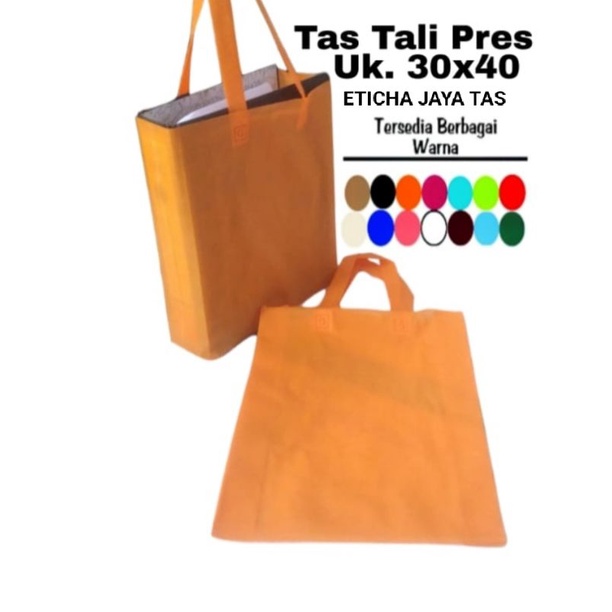 tas spun bond press/goodie bag /tas handle 30x40x8 per lusin isi 12 psc