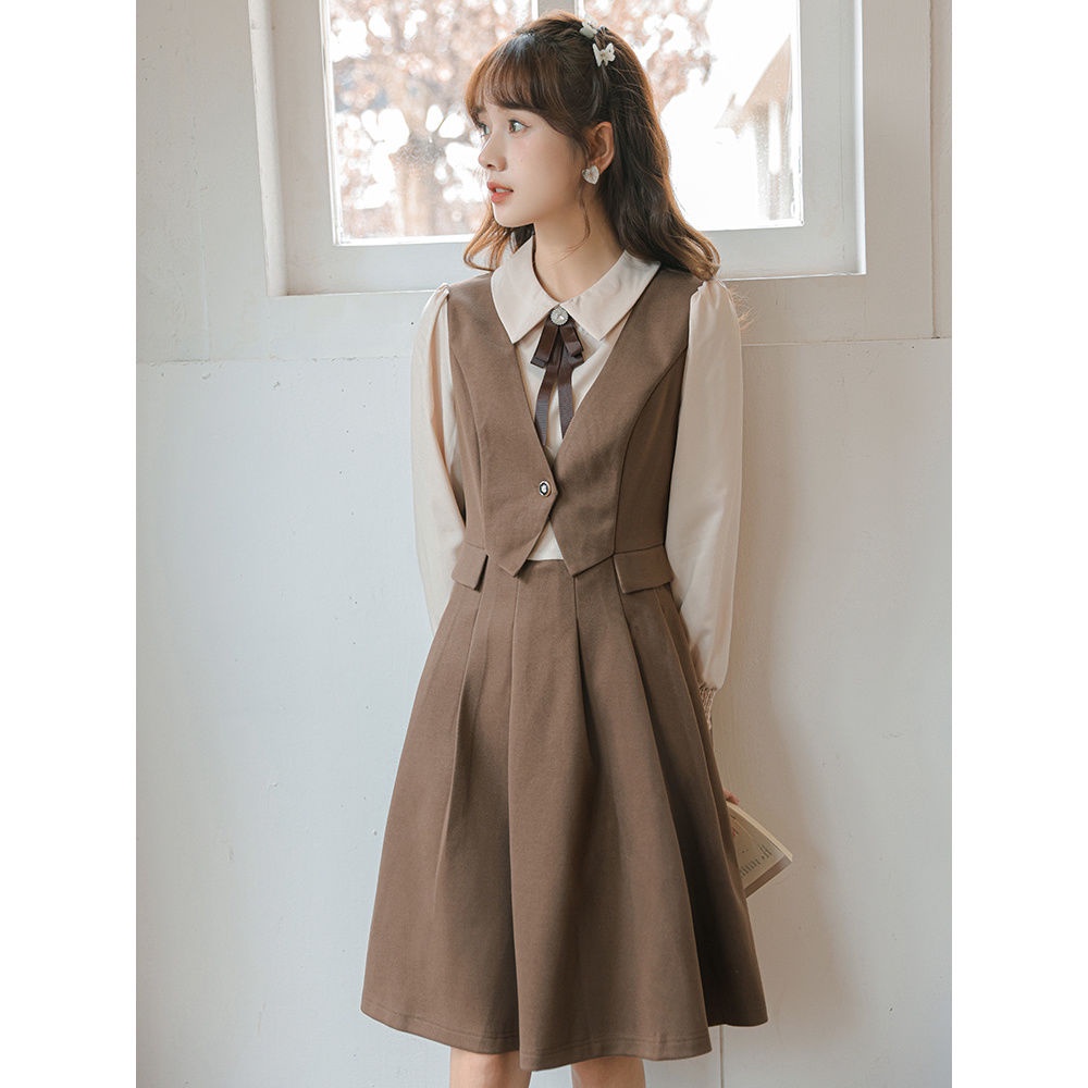 Angin lembut dan temperamen manis penyambungan gaun lipit dua potong palsu pinggang wanita rok A-line siswa ramping