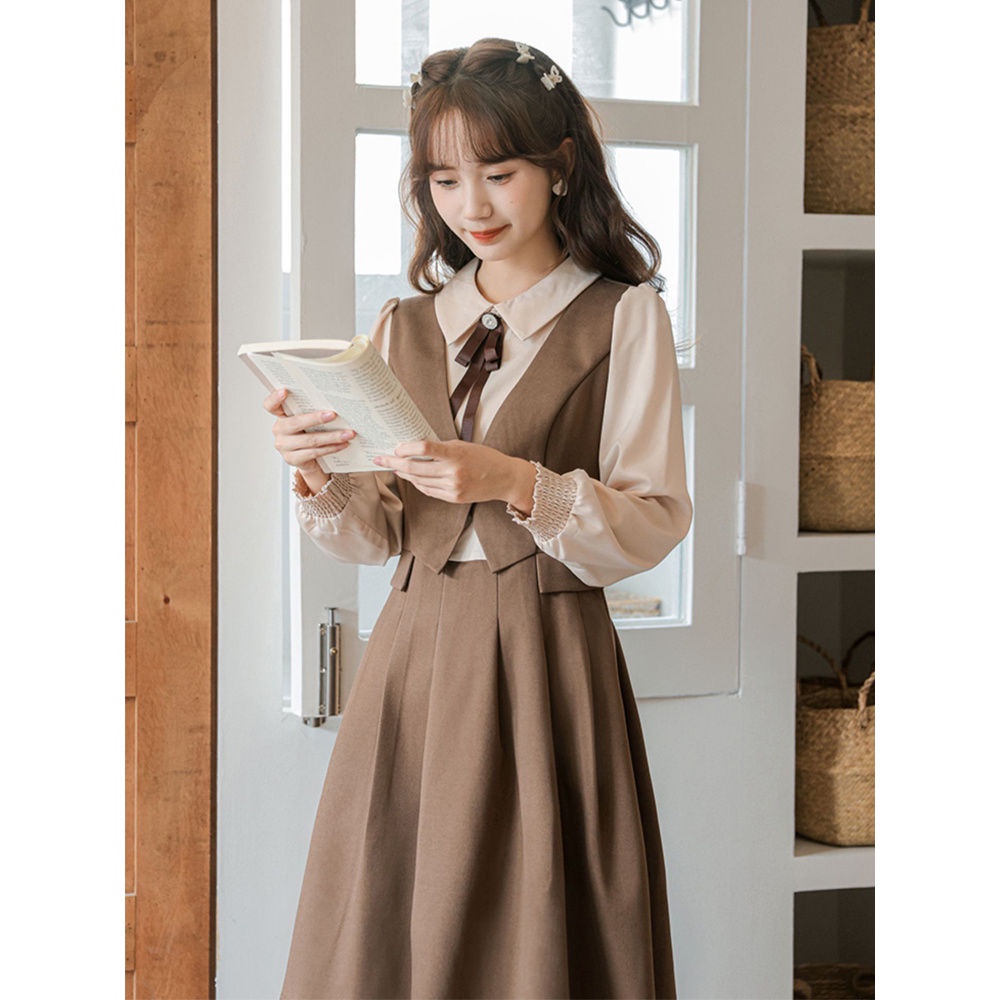 Angin lembut dan temperamen manis penyambungan gaun lipit dua potong palsu pinggang wanita rok A-line siswa ramping