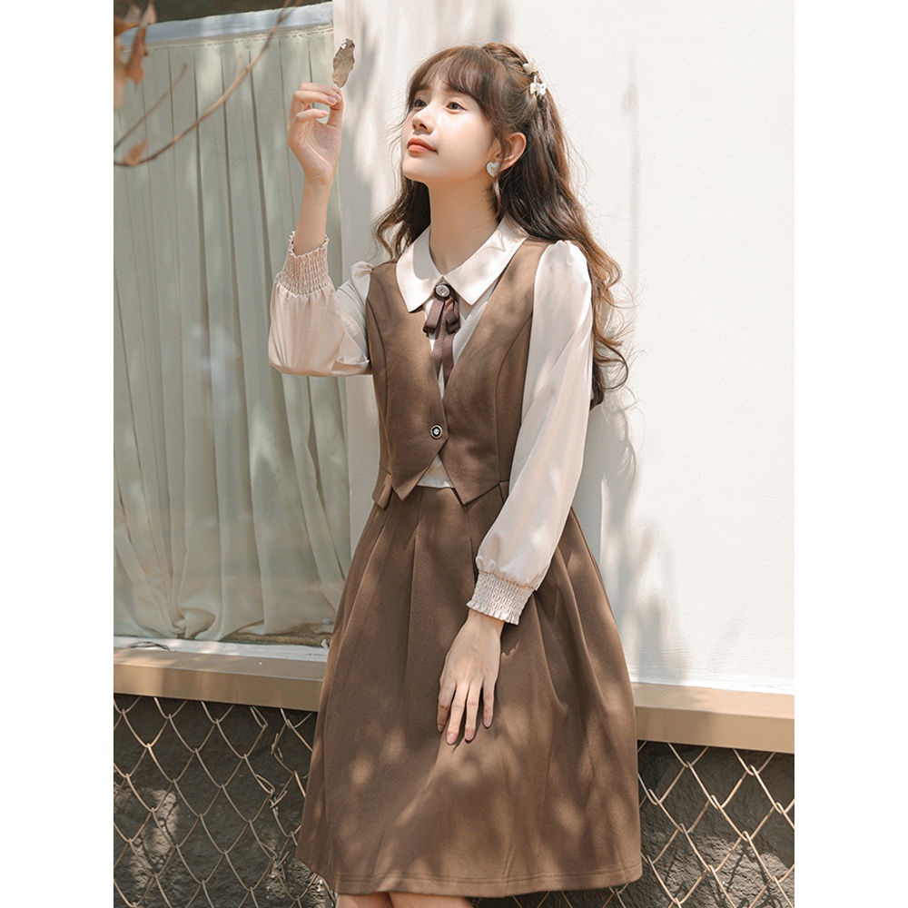 Angin lembut dan temperamen manis penyambungan gaun lipit dua potong palsu pinggang wanita rok A-line siswa ramping