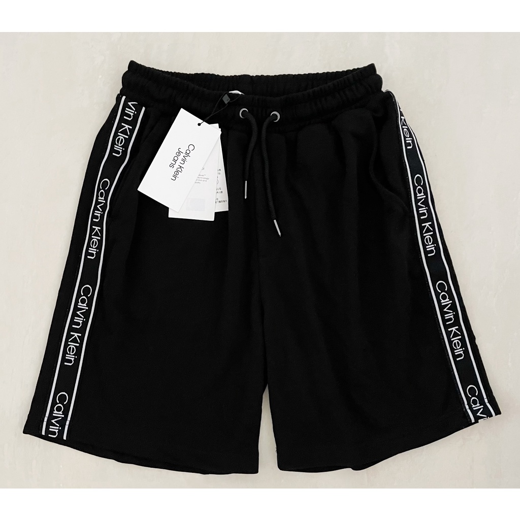 ClvKln logo tape drawstring short pants