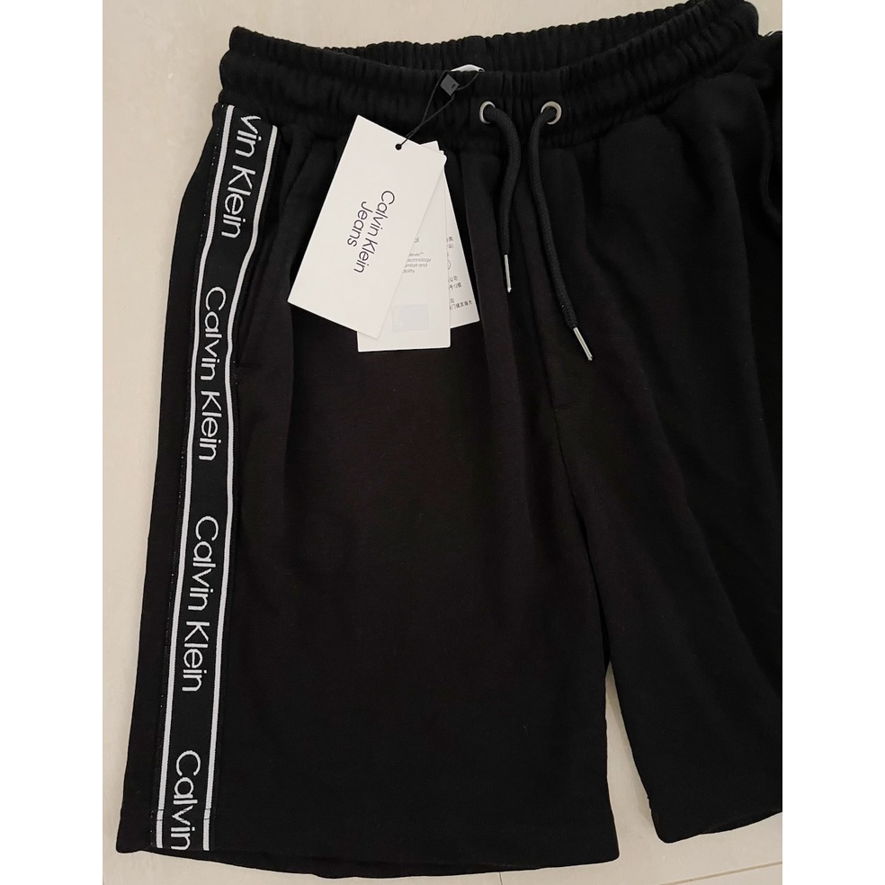 ClvKln logo tape drawstring short pants