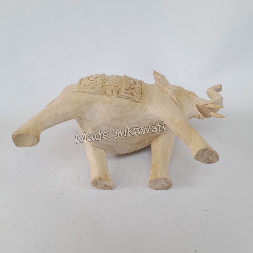 Kerajinan patung kayu gajah berjalan panjang 15cm tinggi 10cm ukiran handmade bali