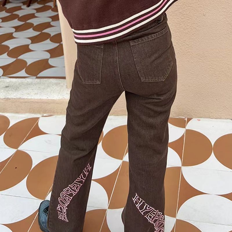 Red Lace-up jeans wanita 2023 baru pinggang tinggi hot girl rasa desain celana coklat Amerika high street longgar lebar kaki celana