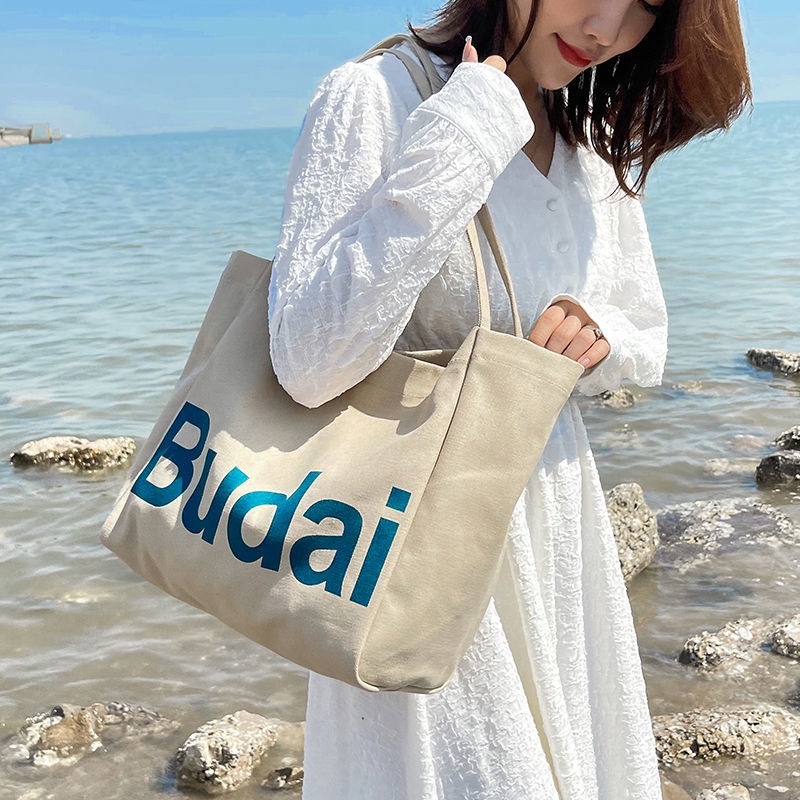₪♤❧Sera  Siswa Kasual Kapasitas Besar Tas Wanita Musim Gugur dan Musim Dingin 2022 Baru Fashion Huruf Kanvas Tas Gaya Korea Single bahu Tas Kain