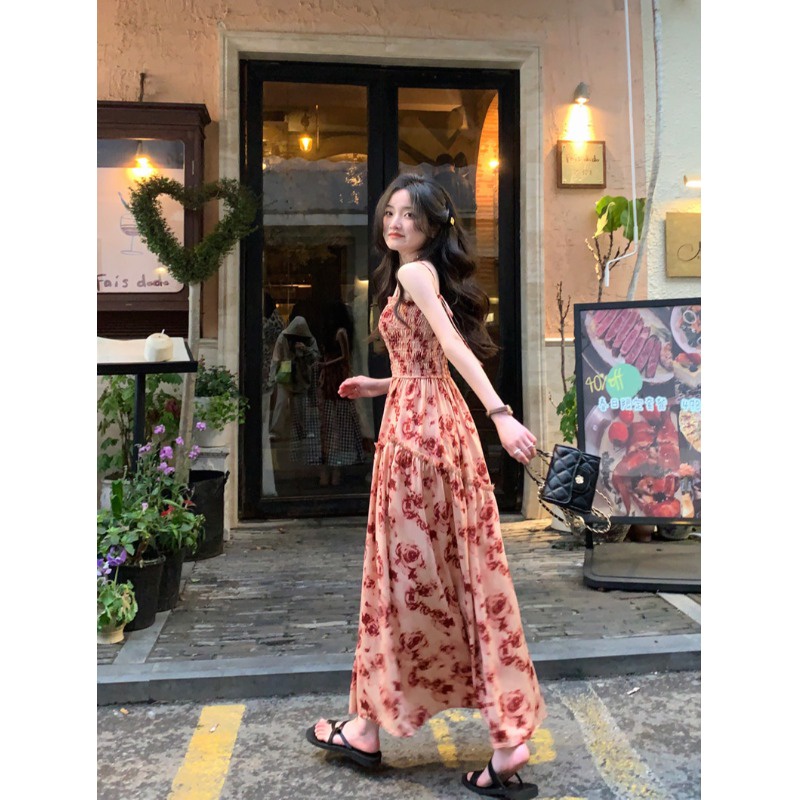 Red French rose print strap suspender dress women s summer 2023 new holiday style pleated waist long skirt