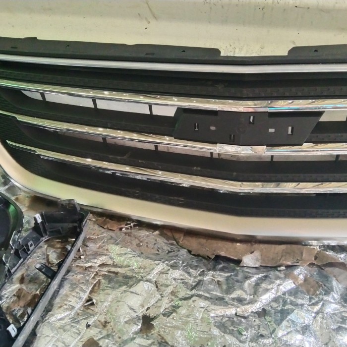Grill Wuling Almaz Tampa Logo
