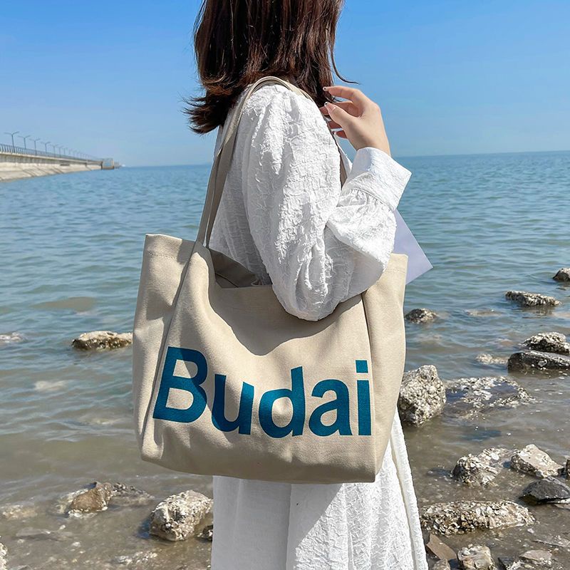 ₪♤❧Sera  Siswa Kasual Kapasitas Besar Tas Wanita Musim Gugur dan Musim Dingin 2022 Baru Fashion Huruf Kanvas Tas Gaya Korea Single bahu Tas Kain