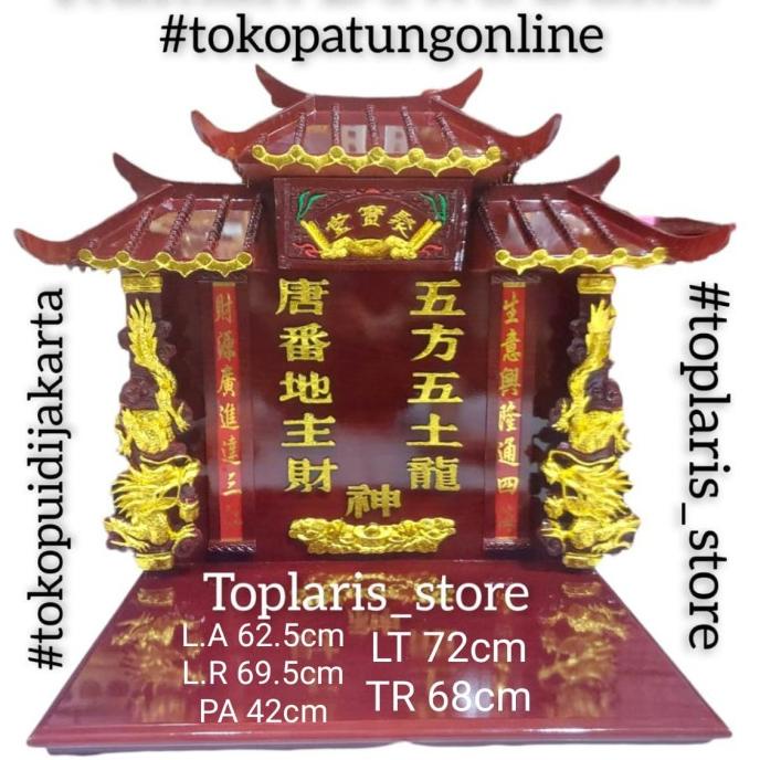 Rumah Dewa Bumi Tutikong Ukir Naga Timbul