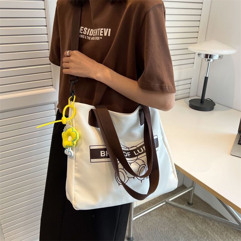 ☫Sera  baru tas kanvas siswa perempuan kapasitas besar tas komuter kelas satu bahu Messenger portable kasual all-match tote bag